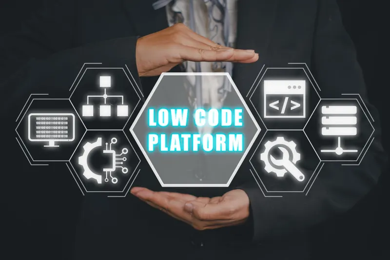 Low-code software development platform concept, hand holding a low-code icon on a virtual screen