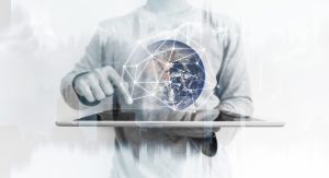Man using digital tablet with global network connection technology hologram