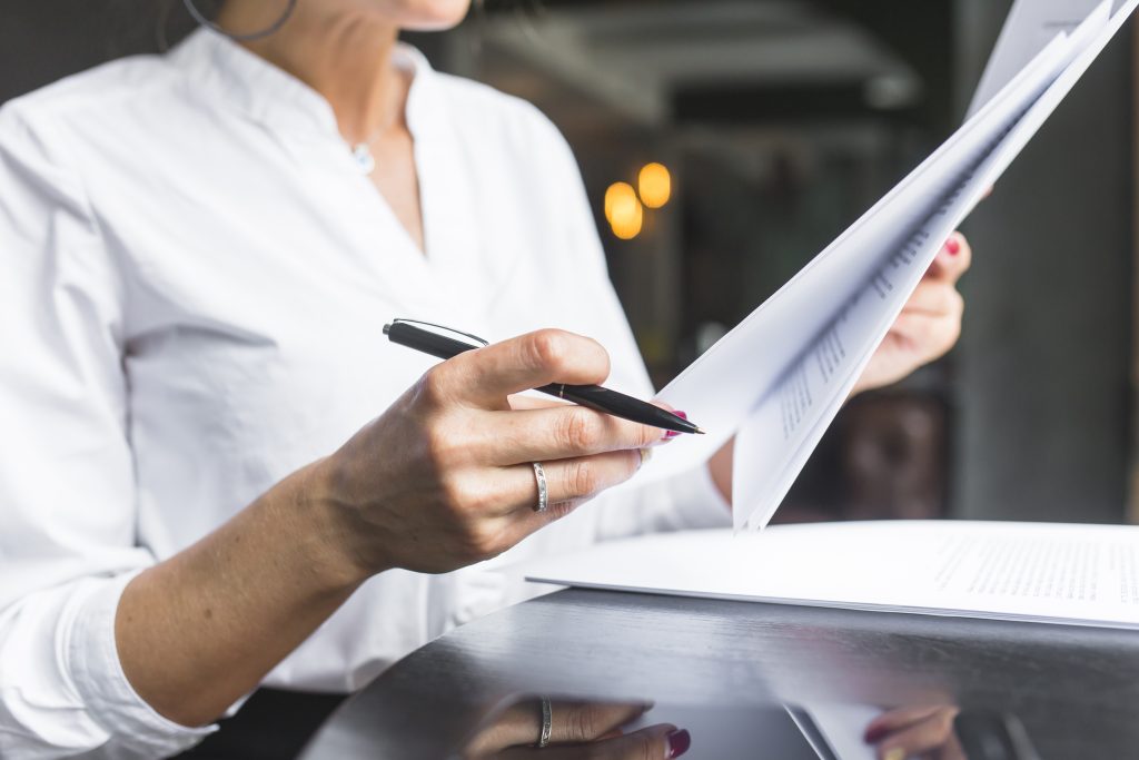 Close up woman examining document