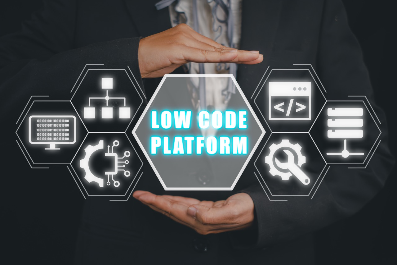 Low Code software development platform technology concept, Woman hand holding Low Code software development platform icon on virtual screen.